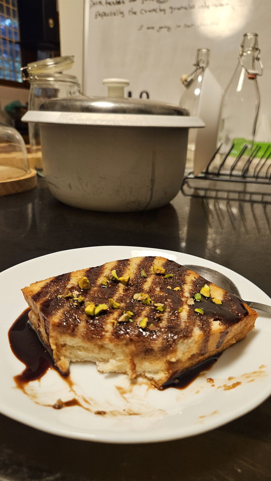 a random dessert drizzled with chocolate sauce and pistacios.. 